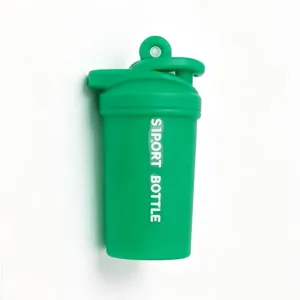Mini sports shaker bottle keychain pendant, green fitness cup key ring bag charm detail.