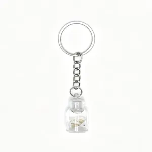 Detailed close-up view of the clear glass drift bottle keychain with mini shell inside.