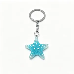 Close-up of sparkling blue resin starfish keychain pendant with silver metal ring.
