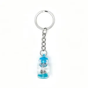 Detailed closeup of a cute drifting bottle keychain pendant with silver metal ring and blue fill.