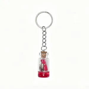 Ocean theme drift bottle keychain with mini glass vial, red liquid and seashell charm.