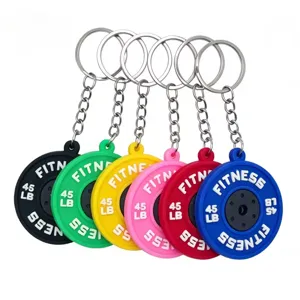 Colorful PVC barbell weight plate keychain detail view, mini gym fitness accessory pendant.