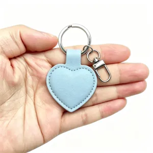Light blue PU leather heart keychain with metal split ring and lobster clasp for daily gifts.