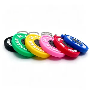 Colorful PVC barbell plate keychains, mini fitness weight pendants, detailed close-up shot.