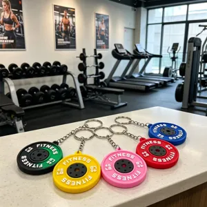 Mini PVC barbell plate keychain set, colorful fitness weight pendant for gym gifts and souvenirs.