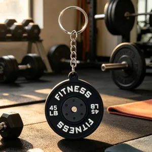 Detailed close-up of a mini PVC barbell weight plate keychain, gym fitness gift accessory.
