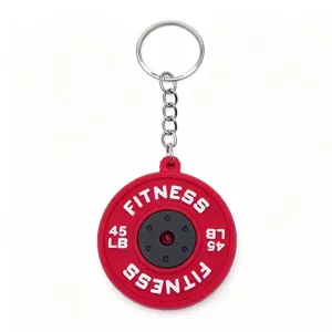 Mini PVC barbell weight plate keychain, fitness gym gift accessory, red metal keyring.
