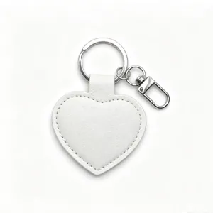 White PU leather heart keychain with silver metal ring and lobster clasp for gifts.
