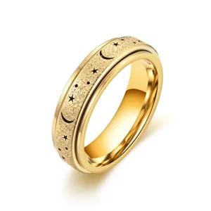 Gold stainless steel spinner ring with frosted star and moon cutout design for anxiety relief.