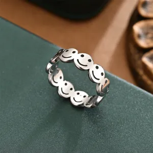 Detail shot of a silver smiling face ring, minimalist metal open band for men and women.