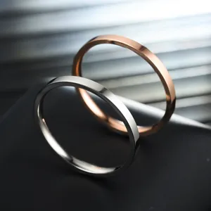 Minimalist stainless steel 2mm thin ring detail view, stylish couple stacking jewelry item.