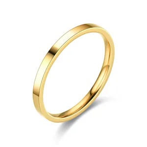Minimalist 2mm gold stainless steel ring detail shot, classic plain stacking band for daily wear.