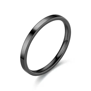 Close-up detail of the 2mm minimalist black stainless steel stackable ring for daily wear.