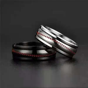 Stainless steel rotatable football ring couple rings detailed shot showing red stitching design