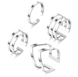 Detail shot of minimalist silver open rings set, geometric adjustable bands for women and toe.