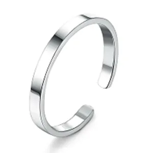 Close up view of minimalist silver tone open toe ring, sleek smooth metal finish detail.