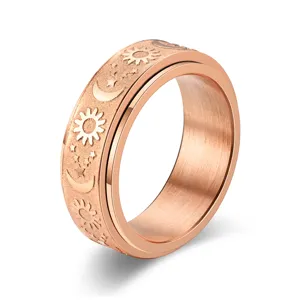 Rose gold titanium steel spinner ring featuring sun moon and stars design for anxiety relief.