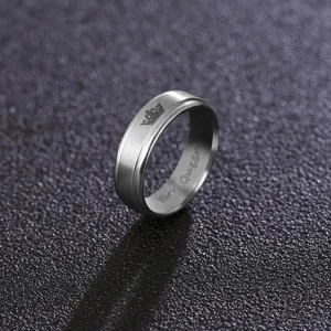 Detail view of 6mm stainless steel couple ring featuring crown engraving and His Queen text.