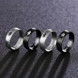 Close-up detail of stylish crown couple rings with Her King and His Queen engravings 6mm.