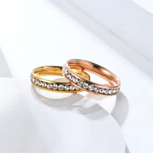 Exquisite stainless steel diamond pave couple rings detail shot, gold and rose gold.