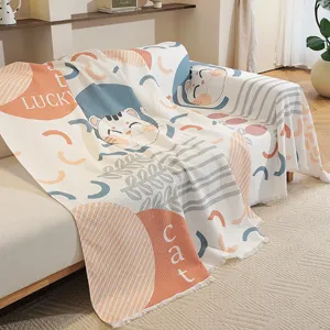 Jeté de canapé gaufré de style nordique avec motif chat porte-bonheur mignon et finitions franges.