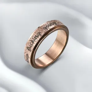 Stainless steel spinner ring for men with pearl sand finish and motivational text.