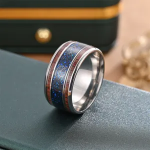 Titanium steel ring featuring wood grain inlay and blue sparkling texture for style.