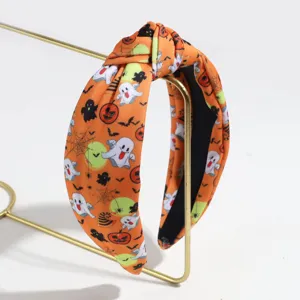 Halloween knotted headband with ghost and pumpkin print, wide hair hoop for women and girls.