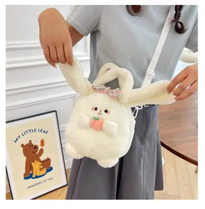 Cute white plush rabbit crossbody bag featuring a pink bow and peach accessory closeup
