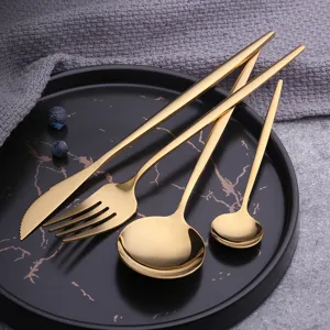 Luxury gold stainless steel flatware set kitchen dining knife fork and spoon tableware.