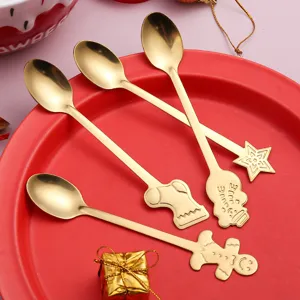 Set di cucchiai di Natale in acciaio inossidabile dorato con manici a forma di omino.