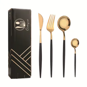 Edelstahl Besteckset mit schwarzen und goldenen Griffen, inklusive Messer, Gabel und Löffel.