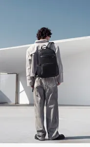 Multifunctional business laptop backpack for men, waterproof travel commuter daypack.