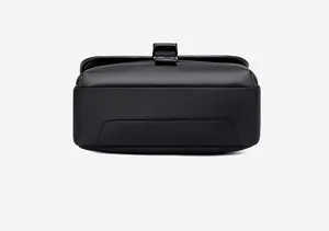 Men's minimalist black crossbody bag detail view, sleek multi-functional design for use.