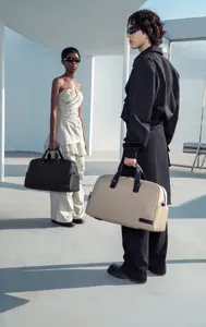 Detailed shot of large capacity travel duffel bag in modern architectural setting.