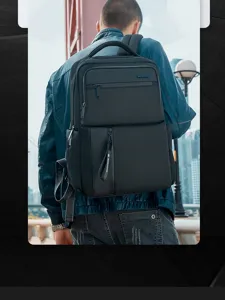 Outdoor detail shot of a black business backpack, multi-compartment design for 15.6 inch laptop.