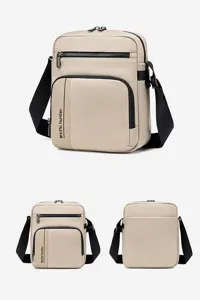 Close-up detail of the nylon cross-body shoulder bag with durable zipper pockets.