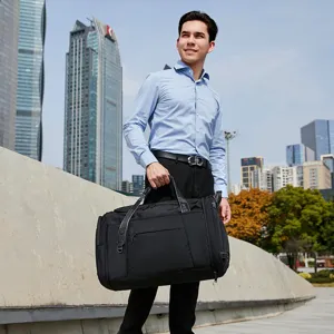 Large capacity black travel duffel bag for outdoor trips, lightweight and water-resistant.