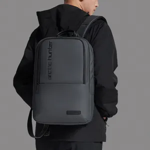Sleek grey business backpack for men, durable and waterproof, ideal for travel and daily commute.