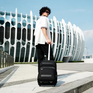Waterproof rolling travel backpack with wheels for business trips, unisex design.