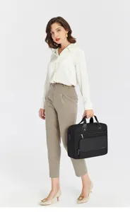 Business laptop briefcase detail view, black commuter shoulder bag with front pocket.
