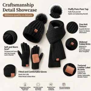 Three-piece winter knit set including black beanie hat with pompom scarf and gloves