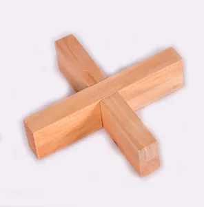 Wooden interlocking puzzle detail view, traditional classic brain teaser toy component for adults.