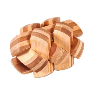 Close-up of bamboo interlocking puzzle brain teaser toy, natural wood texture details.