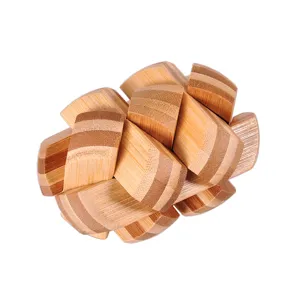 Detailed close-up of the intricate bamboo interlocking puzzle showing fine wood grain texture.