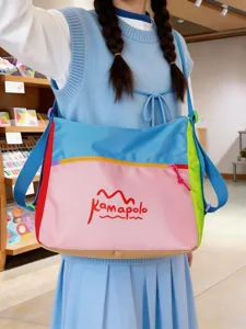 Colorful dopamine canvas shoulder bag with contrast design, perfect for travel and daily use.