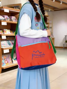 Dopamine color-block shoulder bag, casual large crossbody travel bag with front pocket.