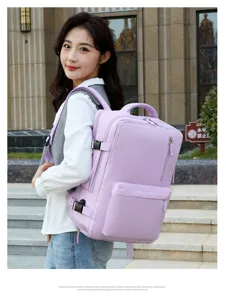 Detailed view of the large capacity purple travel laptop backpack worn by model outdoors.