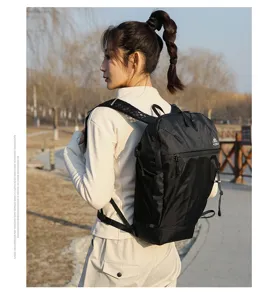 Outdoor sports backpack with large capacity, black grid fabric, ideal for hiking and camping.