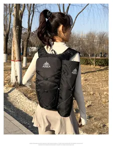 Detail view of black running backpack with water pocket and breathable mesh for sports.